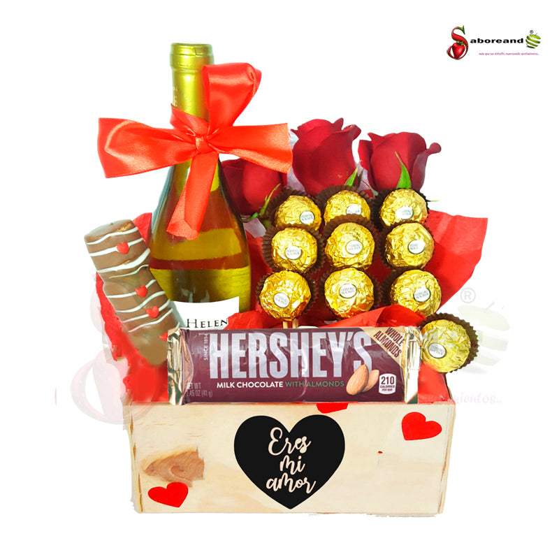 Caja kraf con letras en chocolate, masmelos , botella de vino espumosos, chocolates ferrero rocher y 3 rosas